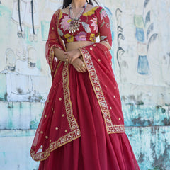 Elegant maroon lehenga choli with intricate swastik and elephant border in dupatta!