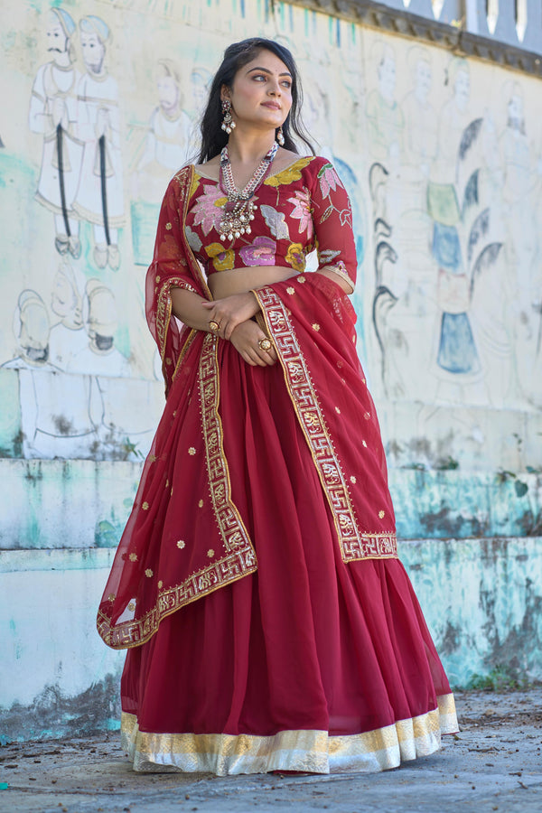Elegant maroon lehenga choli with intricate swastik and elephant border in dupatta!