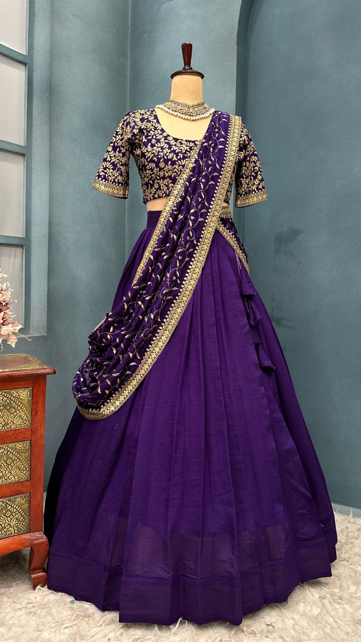 Purple traditional outfit with gold details on a mannequin against a gray background